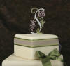 charmed monogram cake topper with crystals on flower and initial