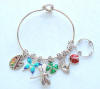 Here is a bride's sterling silver wire heart cuff charm bracelet with the heart spacer beads in-between her charms.