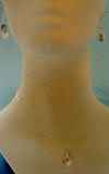 notice the white, cream, gold and black colors on this natural mother of pearl calla lily necklace and earrings jewelry set