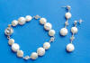 Multi-coin pearsl and cubic zirconias 3-piece bracelet and earrings jewelry set.