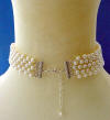 This 5-strand sterling silver freshwater pearl woven choker has sterling silver end bars and a 2" sterling silver extender chain on the back of the necklace.